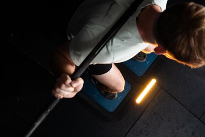 Client lifting a barbell during a strength session